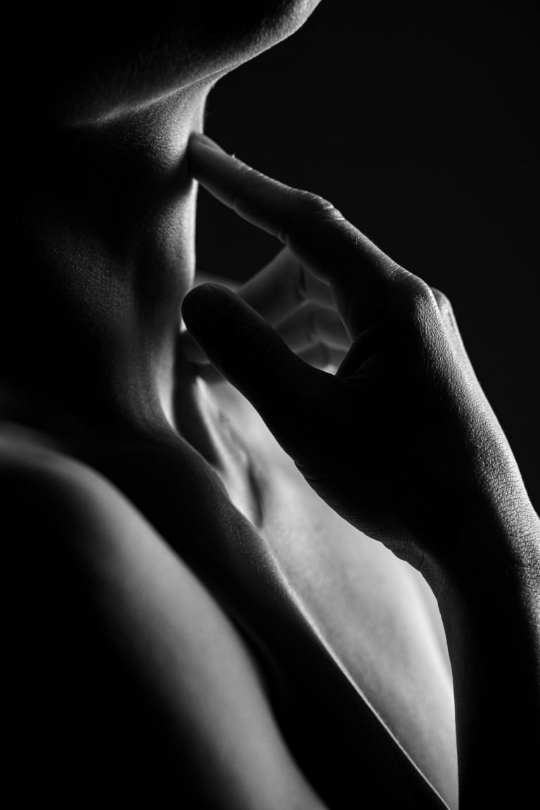 Low key hands, neck, and shadows