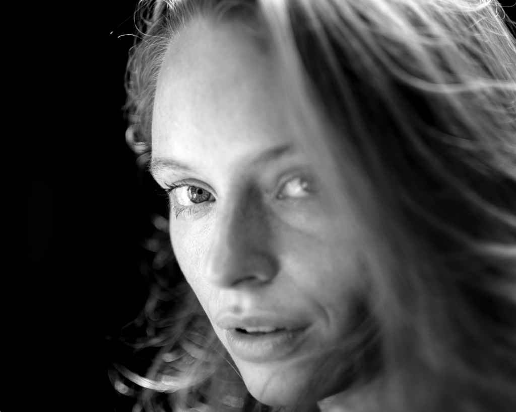 Three quarter side head shot with lots of hair